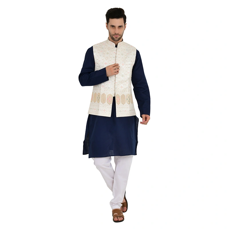 Male model in navy blue kurta with white embroidered Nehru jacket and white pyjama - ethnic wear ecommerce photography by Lohar Studio Delhi